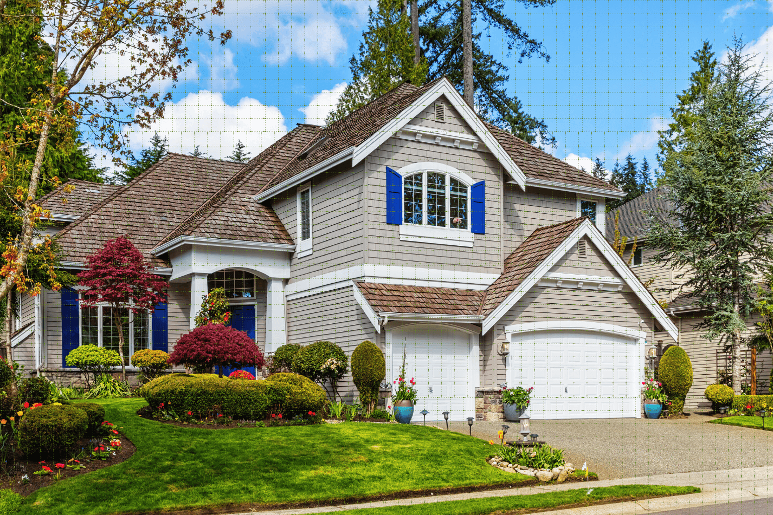 Two-story home with blue shutters